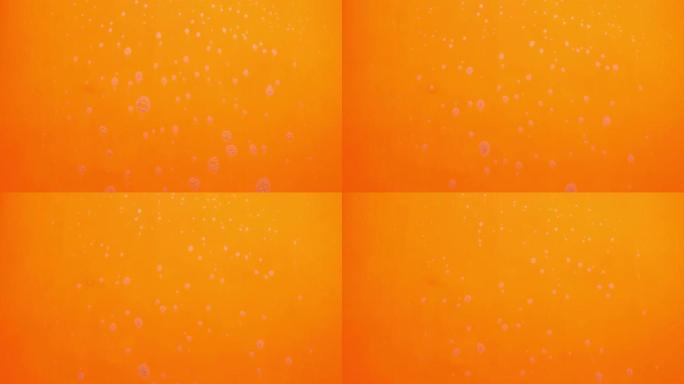 泡沫泡沫从肥皂流动在橙色背景。