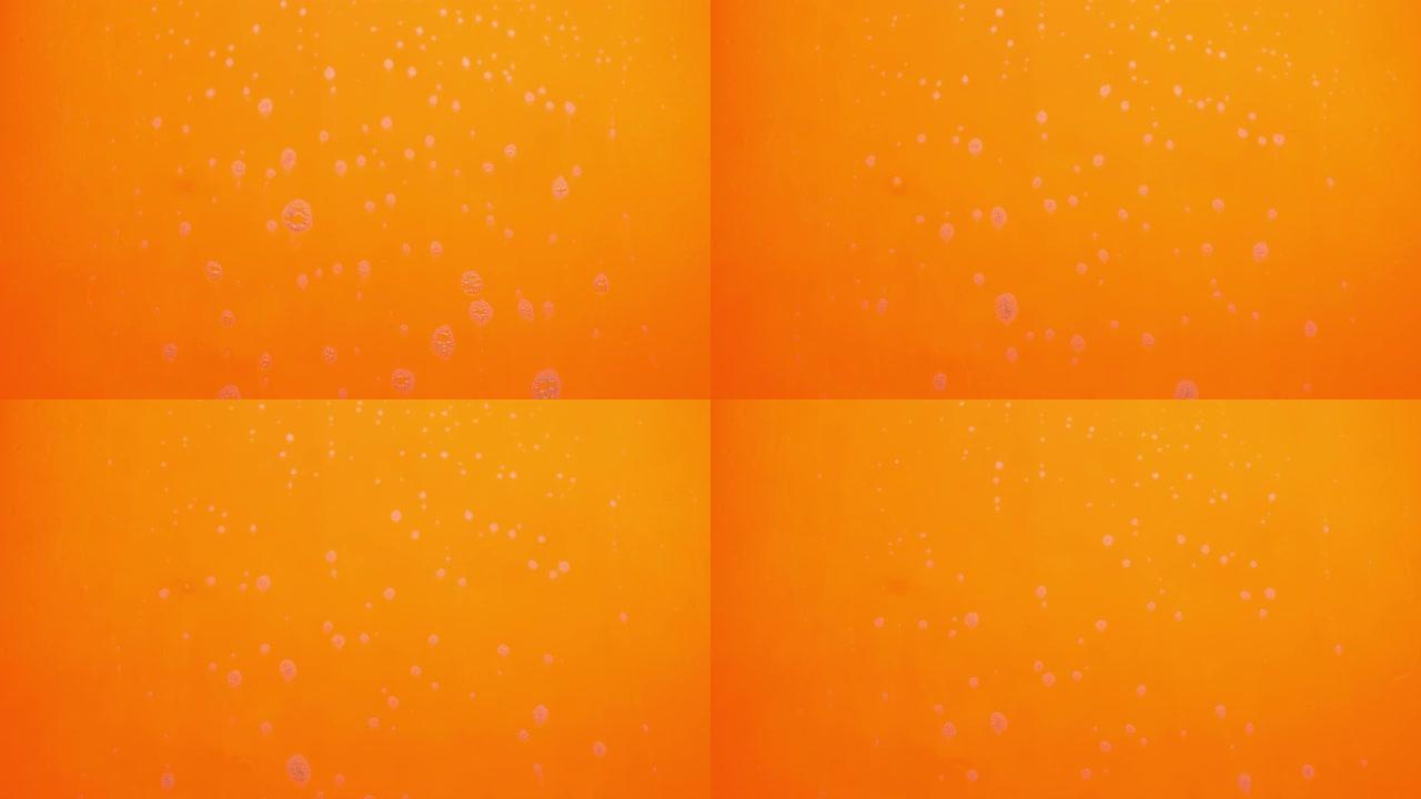 泡沫泡沫从肥皂流动在橙色背景。