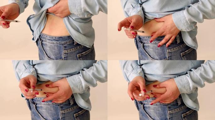 一个女人的特写镜头在胃部的脂肪褶皱中注射了胰岛素。