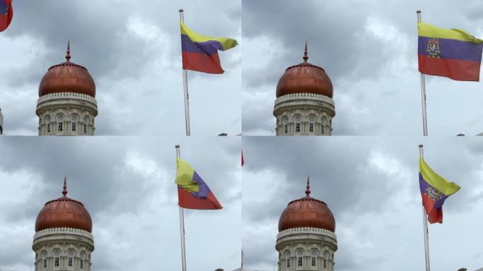 背景为苏丹阿卜杜勒·萨马德钟楼的慢动作马来西亚国旗