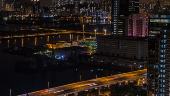 延时俯视图香港城市景观之夜，海港附近城市的天际线