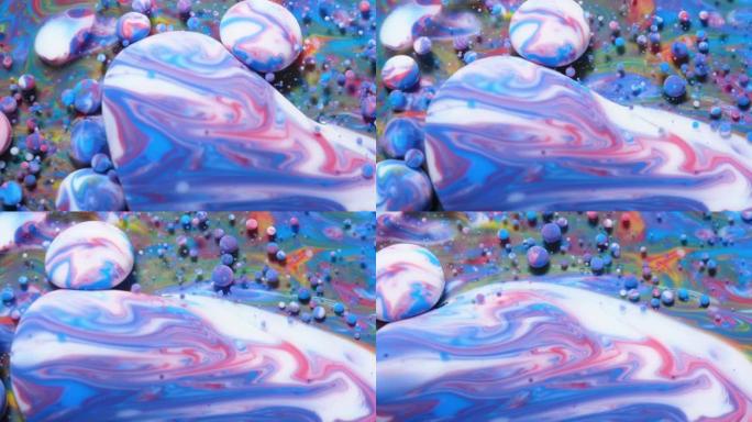 抽象图案化学反应纹理液体油漆运动气泡在水彩蓝色。美丽宇宙中的彩色气泡多色。太空宇宙，神奇的催眠表面。