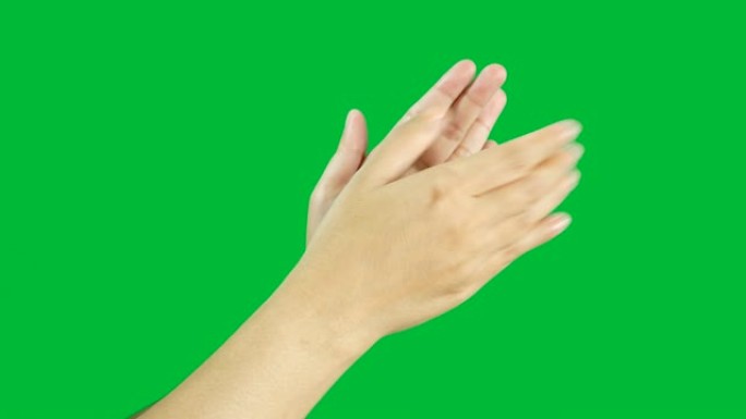 4K.女人双手缓慢鼓掌，掌声孤立在色度键绿色屏幕背景上