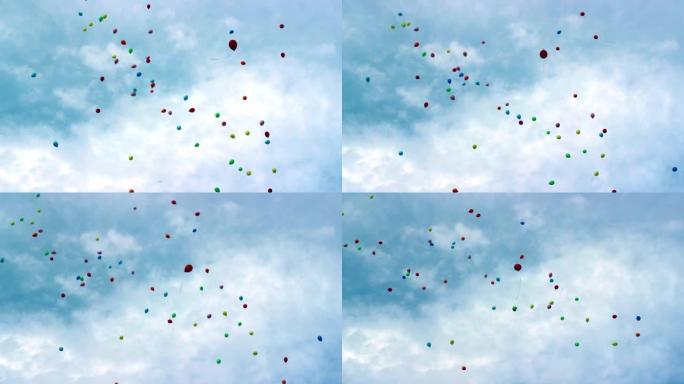 许多五颜六色的气球高高飞向天空。庆祝、乐趣与环境污染生态问题构想