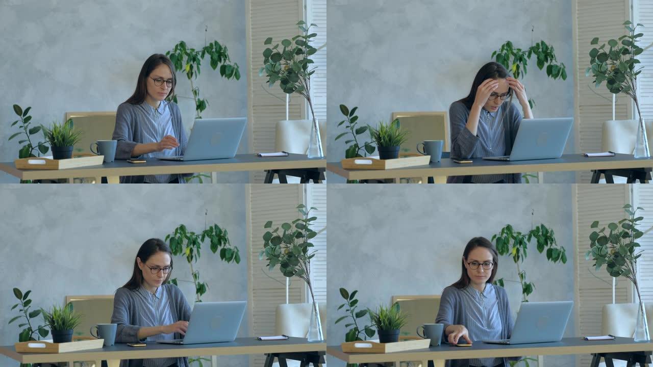 紧张的年轻女子在办公室使用破损的笔记本电脑感到恼火