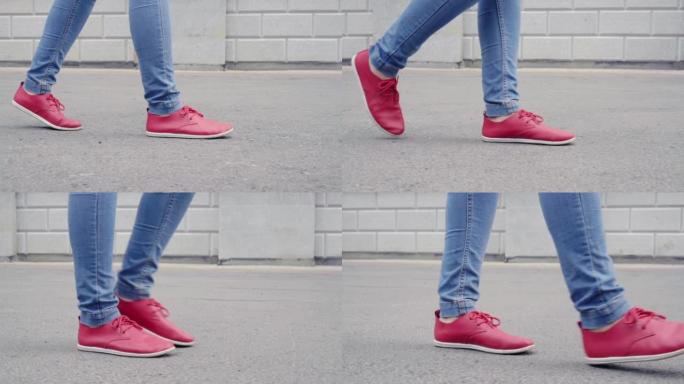 走在街上的女人。特写穿着红鞋的女人腿。侧视图