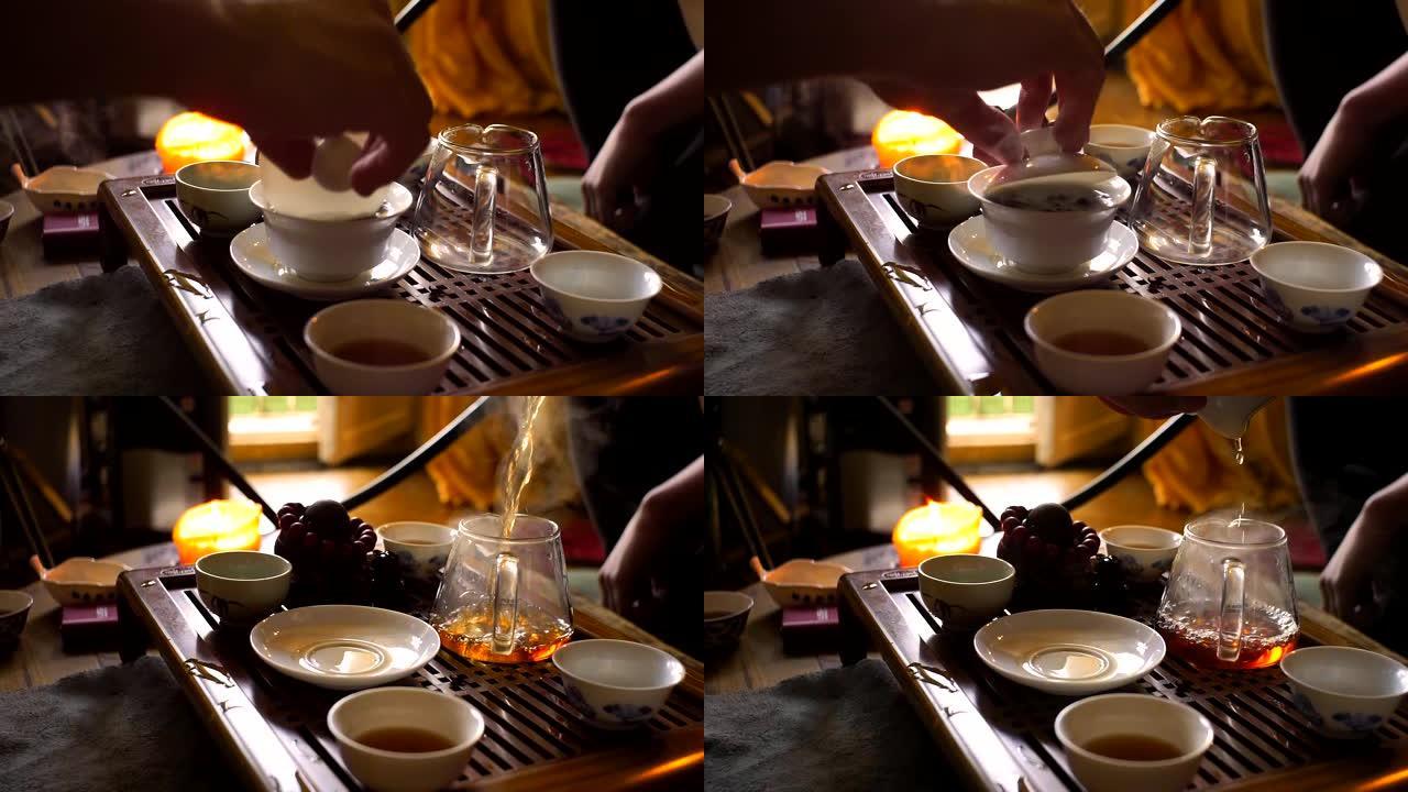 在中国传统茶道中，一名男子用木制功夫茶桌和茶具从粘土茶壶中倒出红茶