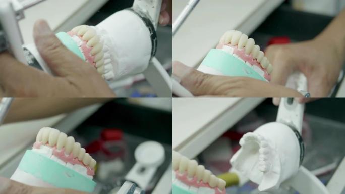 技术人员使用牙科实验室模型来测量工具上的尺寸。