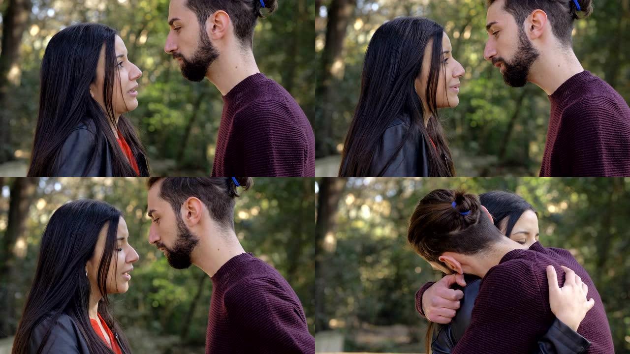 年轻的恋人在公园里吵架，在公园里拥抱。爱，同情