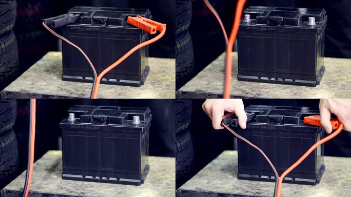 男性的手将端子连接到汽车的电池上。一名男子投掷并移除电池上的端子