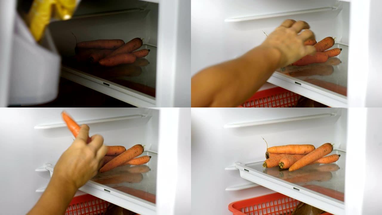 蔬菜冰箱-女性手打开冰箱，拿胡萝卜蔬菜