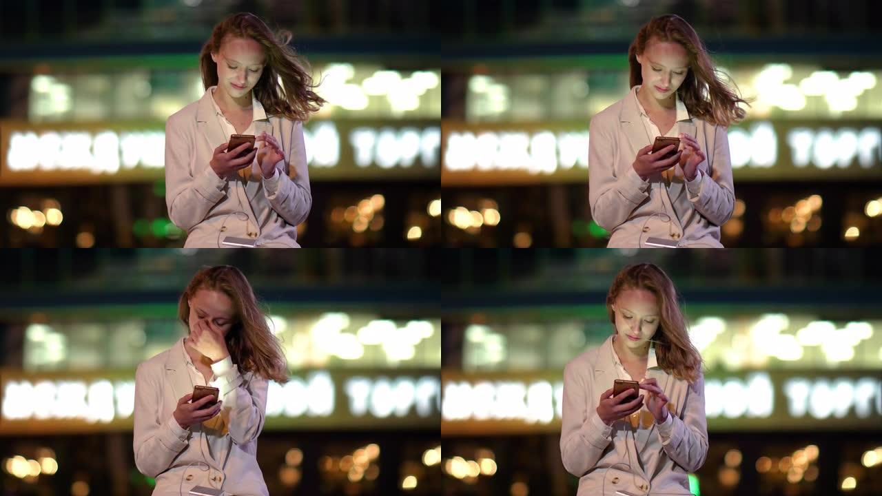 年轻女子在使用手机时给手机充电