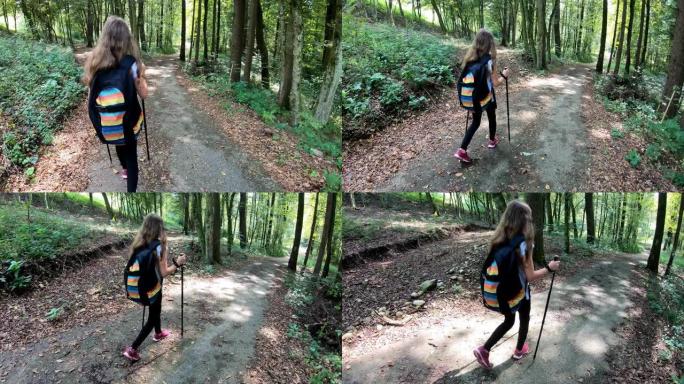 快乐的少女背着背包走在森林里