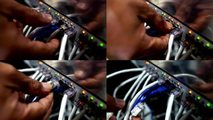 计算机工程师正在修复网络集线器交换机