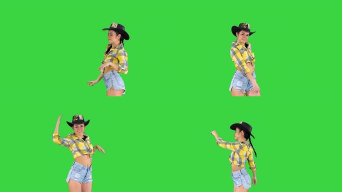牛仔女孩在绿色屏幕上跳舞，色键