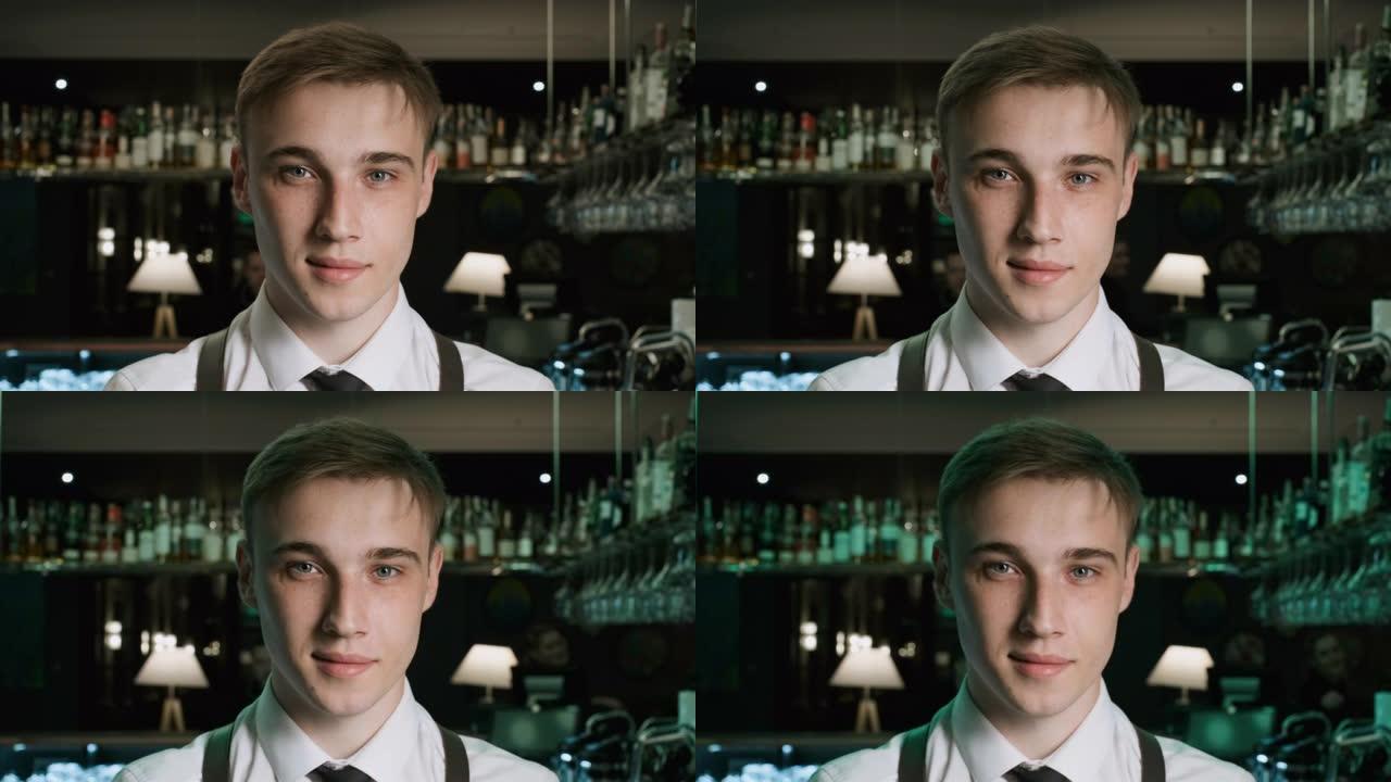 酒吧里英俊的酒保调酒师的肖像。在红色史诗4k Uhd相机上拍摄。