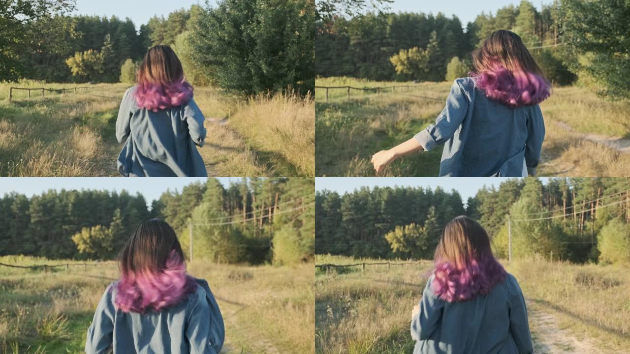 年轻女孩用飘动的紫色头发跑她的背