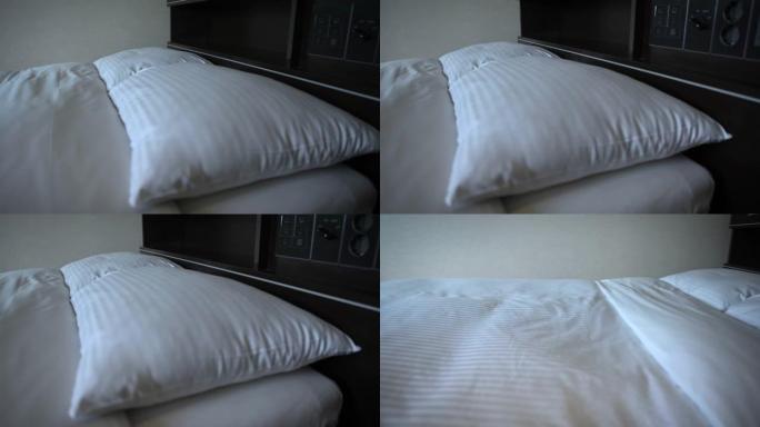 4k酒店房间里有白色床单的双人床