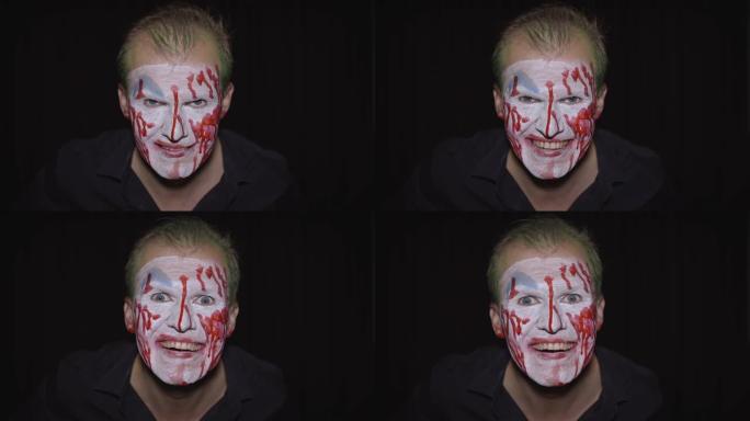 小丑万圣节男子肖像。令人毛骨悚然，邪恶的小丑血脸。白脸妆