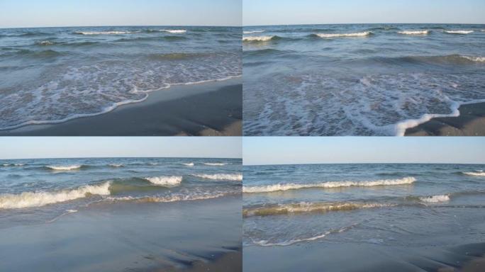 黑海浪压在沙滩上
