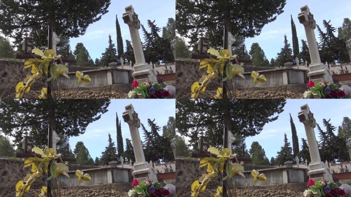 4k西班牙乡村墓地，有墓碑、旧白色十字架和柏树