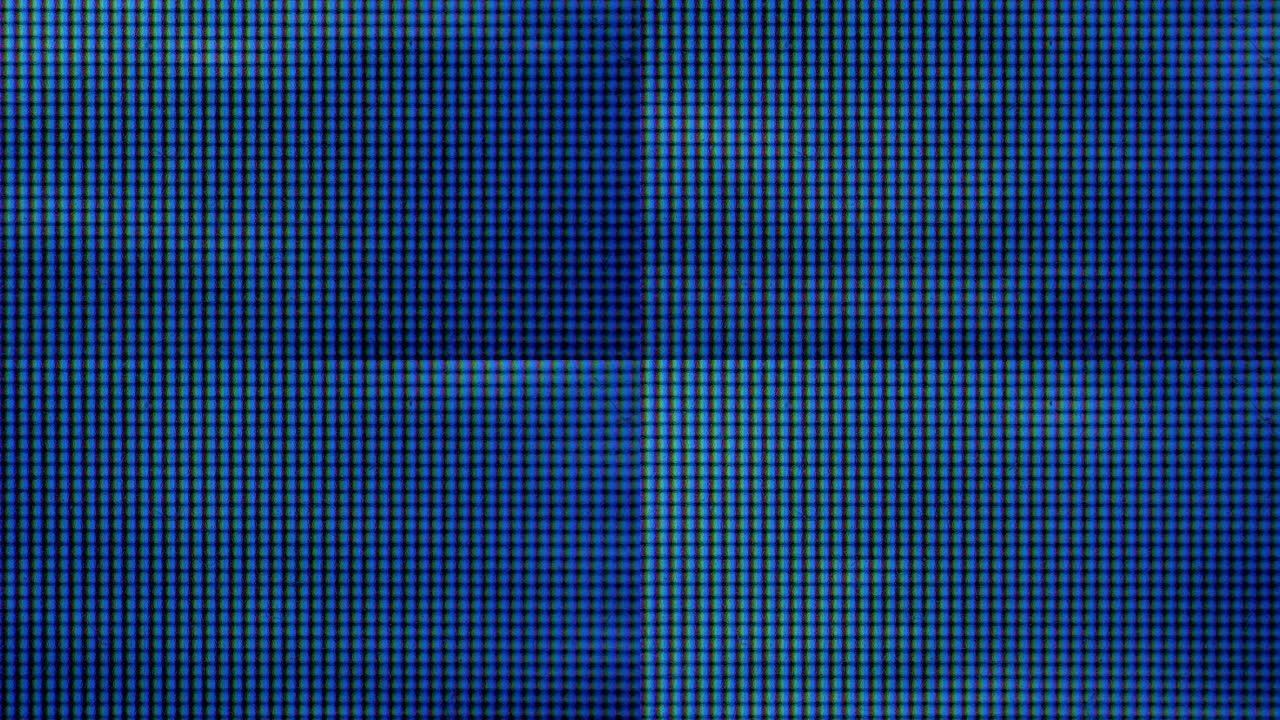 LCD屏幕像素。全息霓虹灯，像素纹理。抽象的彩色背景。采用彩色阴影技术的近距离发光二极管显示器。特写