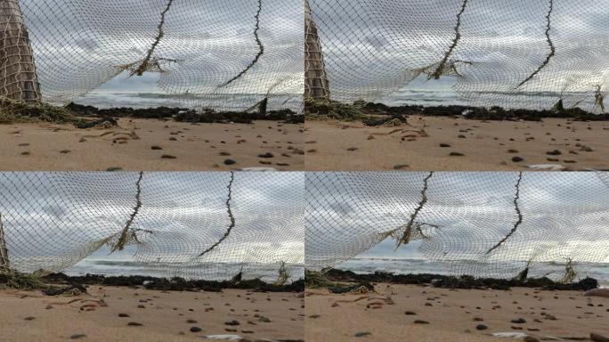 老渔网挂在海边