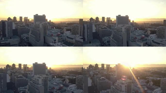 在清晨的喧嚣中，日出的无人机片段照耀着繁忙的城市
