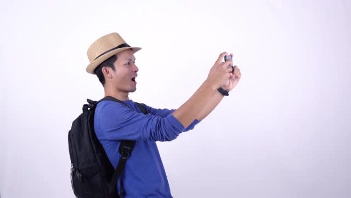 社交媒体上的亚洲泰国游客直播视频，白色背景上的智能手机