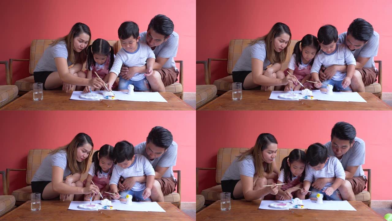 父亲和母亲教儿子和女儿绘画技巧