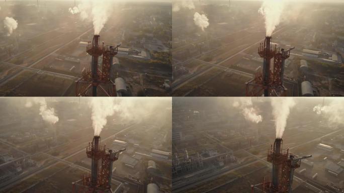 鸟瞰图。框架中是一个化学工业综合体。毒烟从烟囱中冒出来，围绕着几棵植物