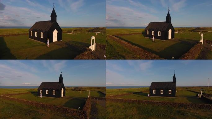 一个年轻女孩探索冰岛的一座黑人教堂。童话时尚故事