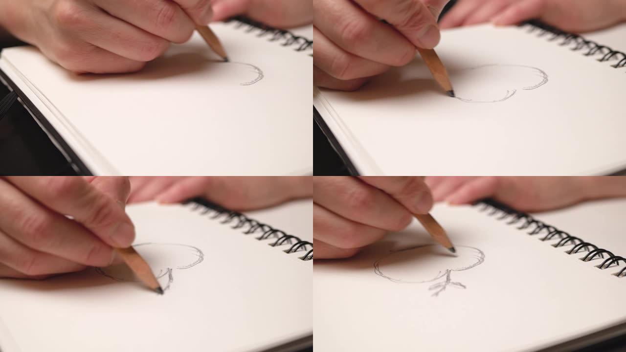 女人在素描本上用铅笔手绘苹果。特写。滑块移动