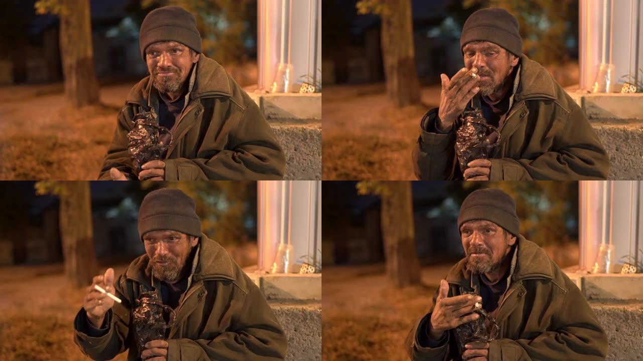 一个无家可归的病人晚上带着烟酒在街上流浪。