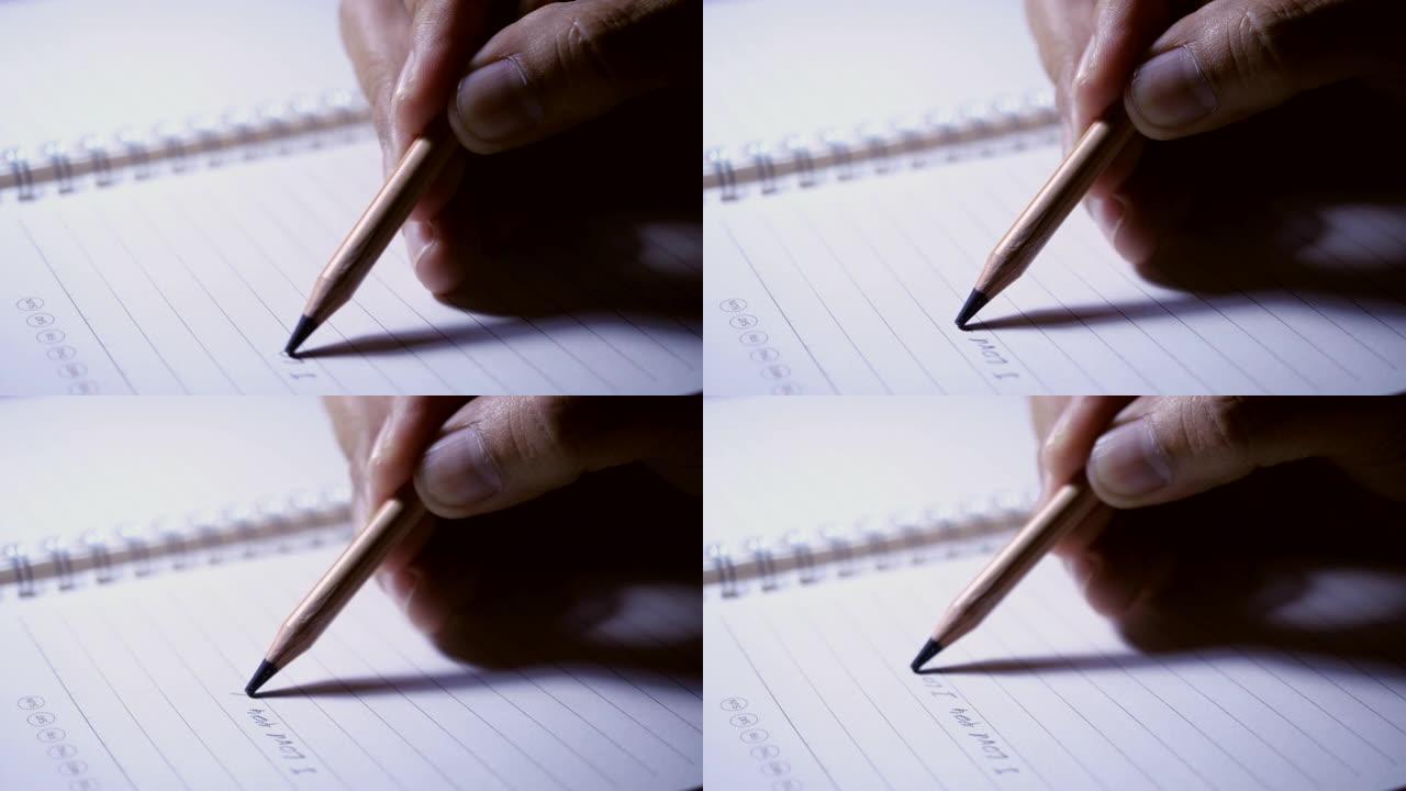 笔记本上手写铅笔的特写