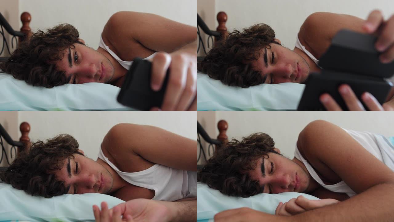 青少年躺在床上休息，放下智能手机小睡