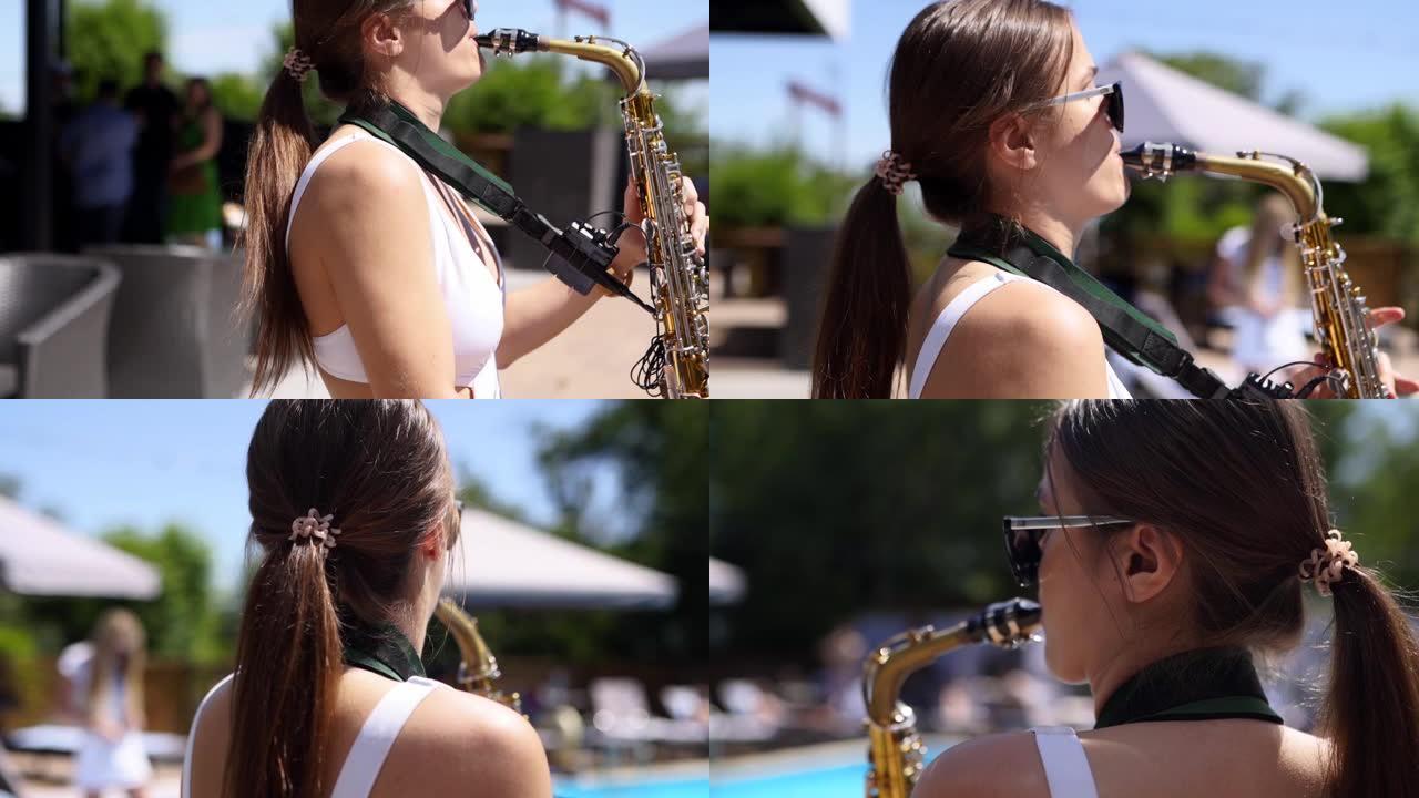 迷人的萨克斯管演奏家女士正在海滩俱乐部游泳池附近的萨克斯管上演奏。穿着热白色比基尼的漂亮萨克斯女音乐