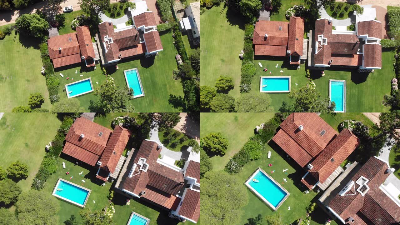 郊区家庭wirth草坪和游泳池的空中无人机