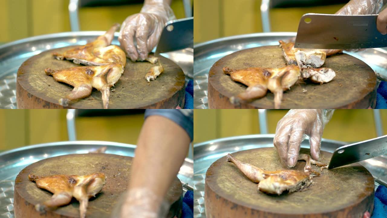 将雄性手切碎在木制砧板上的脆皮烤鸡