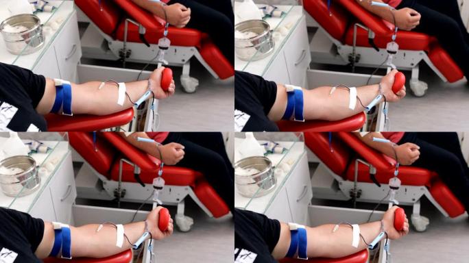 善行。为身体献血的好处。接受输血的朋友的手。献血者在医疗诊所献血的特写