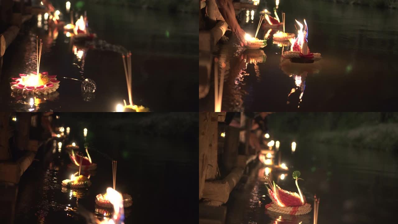 泰国满月民俗节中漂浮的loy kathong和蜡烛