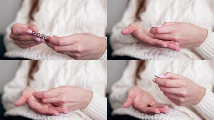顺势疗法药物。女性双手在手掌中打开维生素和益生菌丸，特写。天然无害药物的概念