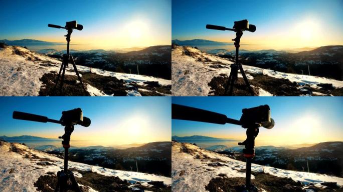 三脚架上的相机摄影师拍摄了风景秀丽的冬景