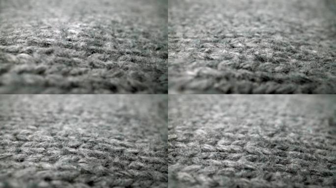 宏观多莉镜头中流动的羊毛布纹理的极端细节视图。