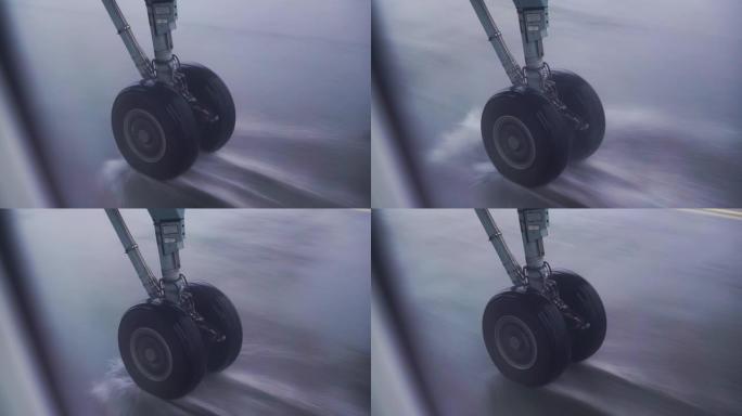 飞机起落架在大雨中滑行跑道