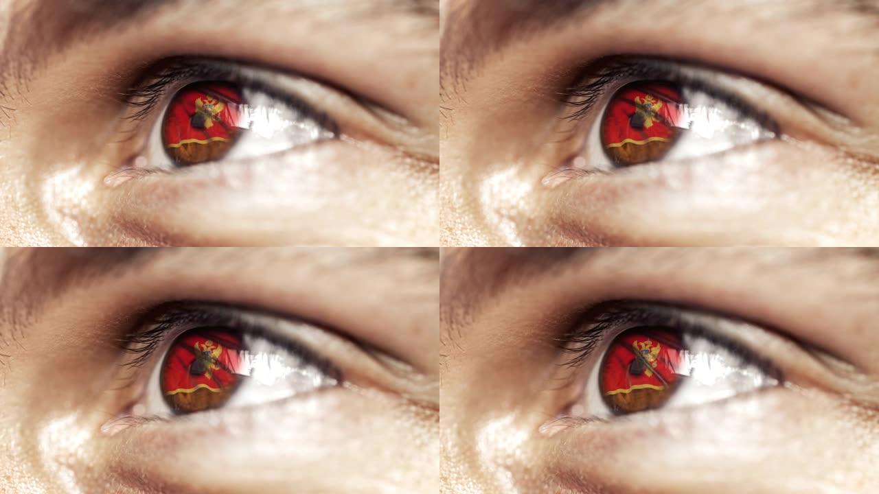 男人棕色的眼睛在近距离与黑山旗虹膜，与风运动。视频的概念