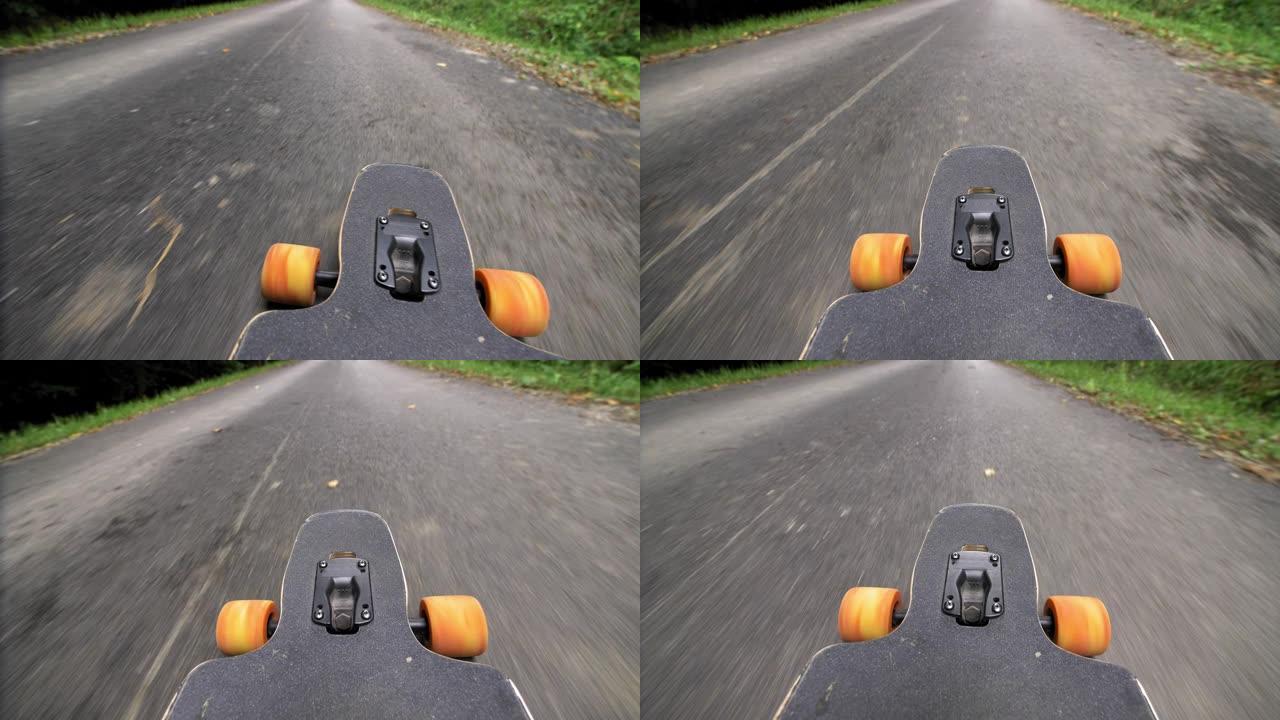 橙色车轮长板滑板骑行下坡沥青路视点