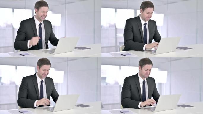 失望的中年商人在办公室感到愤怒