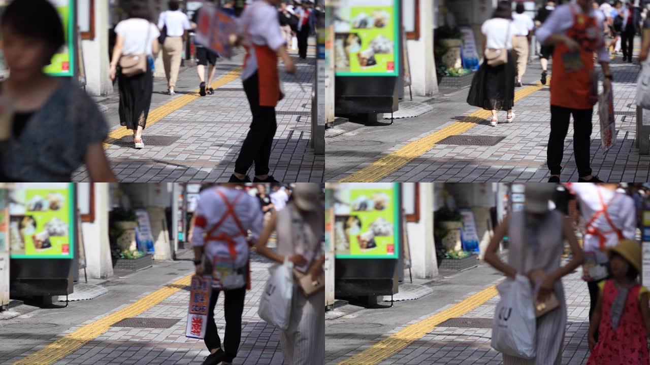 在新宿的市中心街道上行走的人