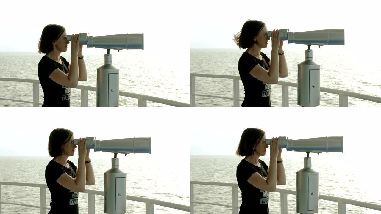 深色头发的女人透过地中海的旅游双筒望远镜看。4K